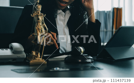 Judge gavel with Justice lawyers having team meeting at law firm background. Concepts of Law and Legal services. Judge gavel with Justice lawyers having team meeting at law firm background. Concepts of Law and Legal services. 111437139
