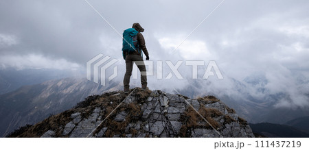 Woman hiker hiking at mountain top in tibet 111437219