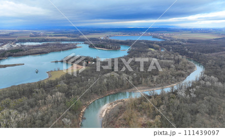 River floodplain winter delta Zastudanci meander drone aerial inland video shot in sandy sand alluvium freezing cold national nature reserve, benches forest and lowlands wetland swamp, view flying fly River floodplain winter delta Zastudanci meander drone aerial inland video shot in sandy sand alluvium freezing cold national nature reserve, benches forest and lowlands wetland swamp, view flying fly 111439097