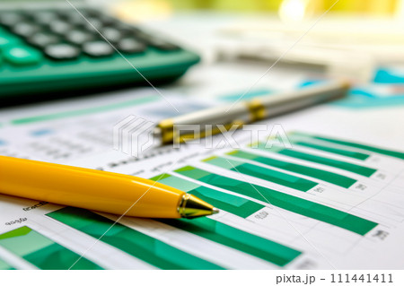 Workplace of bookkeeper with calculator and papers on desk office. Financial data analyzing and accounting concept 111441411