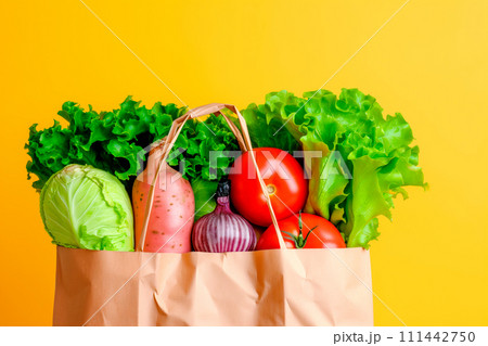 Craft brown shopping paper bag and grocery on blue background. Delivery concept 111442750