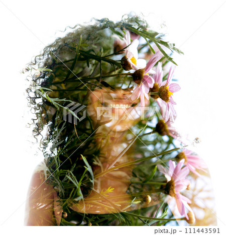 A full-front double exposure floral portrait of a young smiling woman A full-front double exposure floral portrait of a young smiling woman 111443591