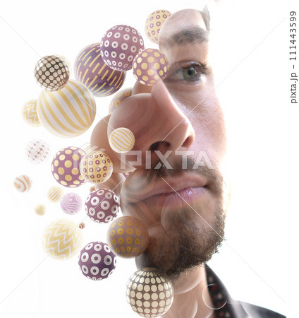 A double exposure close-up portrait of a young man combined with 3D spheres. A double exposure close-up portrait of a young man combined with 3D spheres. 111443599