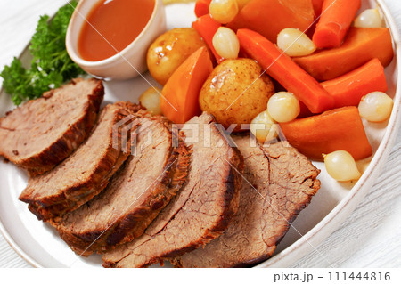 roast beef with dipping sauce and winter veggies roast beef with dipping sauce and winter veggies 111444816