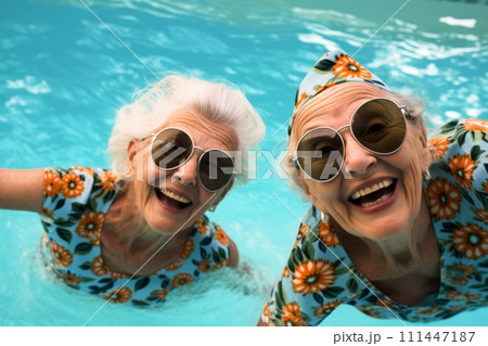Active senior women swimming in the pool 111447187