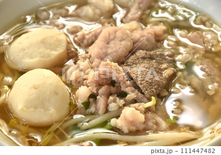 boiled slice soft and chop pork and meatball in clear soup on bowl boiled slice soft and chop pork and meatball in clear soup on bowl 111447482