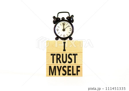 I trust myself symbol. Concept words I trust myself on wooden blocks. Black alarm clock. Beautiful white table white background. Business, psychological and I trust myself concept. Copy space. I trust myself symbol. Concept words I trust myself on wooden blocks. Black alarm clock. Beautiful white table white background. Business, psychological and I trust myself concept. Copy space. 111451335