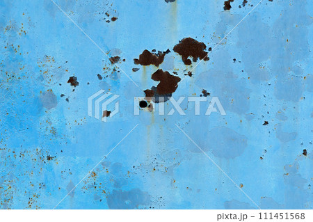 Blue metal and paint creating textured wall background 111451568
