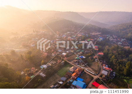 Sunrise over Thai tribe village in foggy with wild himalayan cherry tree blooming at Ban Rong Kla, Thailand Sunrise over Thai tribe village in foggy with wild himalayan cherry tree blooming at Ban Rong Kla, Thailand 111451990