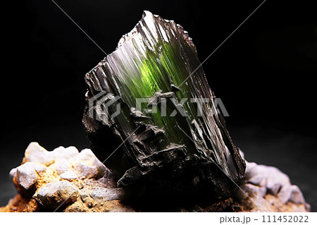 Achavalite is a rare precious natural stone on a black background. AI generated. Header banner mockup with space. Achavalite is a rare precious natural stone on a black background. AI generated. Header banner mockup with space. 111452022