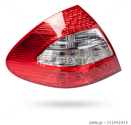 Stylish headlight stop signal made of white and red transparent glass on a white isolated background in a photo studio. Detail for replacement and sale in a car service. Stylish headlight stop signal made of white and red transparent glass on a white isolated background in a photo studio. Detail for replacement and sale in a car service. 111452913