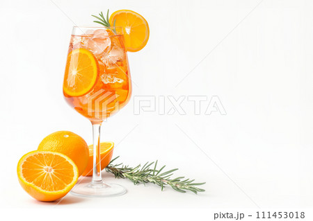 A glass of Aperol Spritz cocktail with oranges and rosemary sprig isolated on white background A glass of Aperol Spritz cocktail with oranges and rosemary sprig isolated on white background 111453018