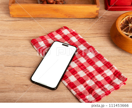 Berlin Germany January 21 2024 Iphone screen mockup, mobile phone mock up on kitchen table 111453666