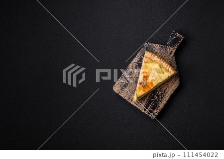 Delicious crispy quiche cut into slices with cheese, broccoli, tomatoes Delicious crispy quiche cut into slices with cheese, broccoli, tomatoes 111454022