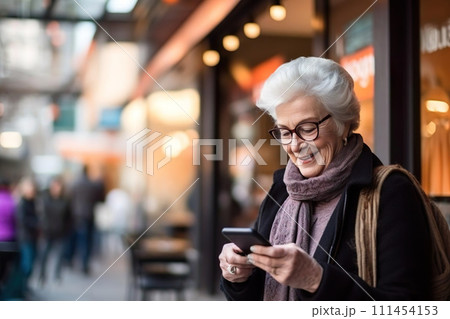 Happy old senior woman, granny using mobile phone, smiling, looking at smartphone, texting. Happy old senior woman, granny using mobile phone, smiling, looking at smartphone, texting. 111454153