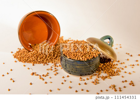 Bowl with raw uncooked buckwheat, Raw Buckwheat Pile, Dry Buck Wheat Grains, Uncooked Buckwheat Bowl with raw uncooked buckwheat, Raw Buckwheat Pile, Dry Buck Wheat Grains, Uncooked Buckwheat 111454331