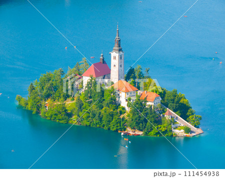 Aerial view of island with church in the middle of Bled lake, Slovenia Aerial view of island with church in the middle of Bled lake, Slovenia 111454938