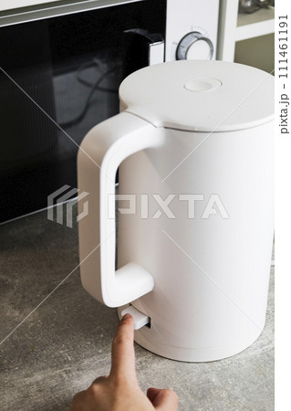 Includes an electric kettle for boiling water. Energy saving concept, expensive electricity Includes an electric kettle for boiling water. Energy saving concept, expensive electricity 111461191