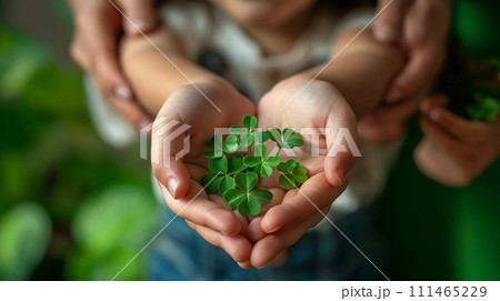Family's hands, young and old, holding St. Patrick's Day four-leaves shamrocks. AI Generated Family's hands, young and old, holding St. Patrick's Day four-leaves shamrocks. AI Generated 111465229