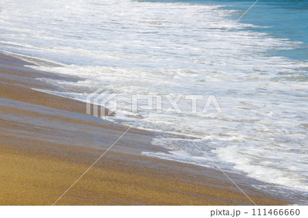 Beautiful view of the sandy beach and the waves of the sea. Beautiful view of the sandy beach and the waves of the sea. 111466660