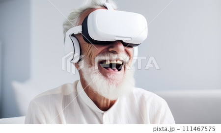 Portrait of a happy smiling enthusiastic elderly old, senior wearing a virtual reality headset in a white room. Portrait of a happy smiling enthusiastic elderly old, senior wearing a virtual reality headset in a white room. 111467575