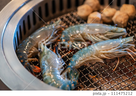 Grilled river prawns on a hot charcoal grill. Grilled prawns, 111475212