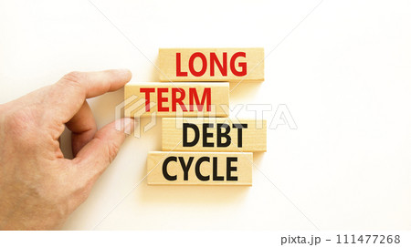 Long term debt cycle symbol. Concept words Long term debt cycle on beautiful wooden block. Beautiful white table white background. Businessman hand. Business Long term debt cycle concept. Copy space. Long term debt cycle symbol. Concept words Long term debt cycle on beautiful wooden block. Beautiful white table white background. Businessman hand. Business Long term debt cycle concept. Copy space. 111477268