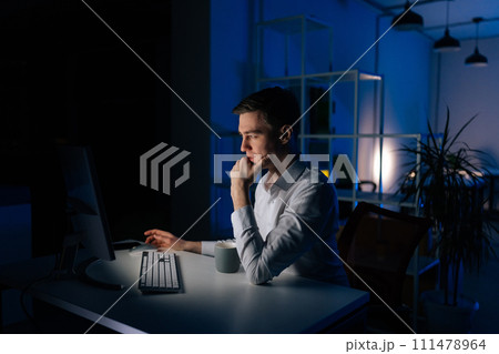 Side view of businessman touching chin thinking business problems in office. Frustrated pensive man working computer analyzing strategy. Nervous employee feeling stress looking solution at workplace. Side view of businessman touching chin thinking business problems in office. Frustrated pensive man working computer analyzing strategy. Nervous employee feeling stress looking solution at workplace. 111478964