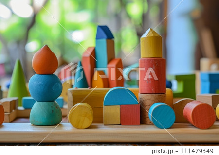 A variety of natural wooden children's toys on the shelves , children's playroom A variety of natural wooden children's toys on the shelves , children's playroom 111479349