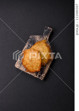 Delicious crispy pancakes made from potatoes, meat, carrots, onions 111480307
