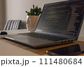 Laptop setup to work from home. Programming and coding. Phone and wireless devices. 111480684