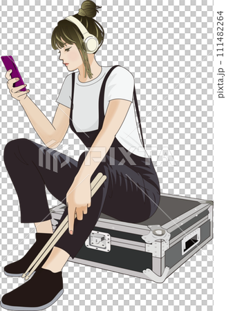 Drummer woman listening to music with headphones 111482264