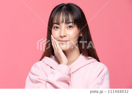Young Beautiful Asian woman smile with clean and fresh skin Happiness and cheerful with positive emotional pointing up,isolated on pink background,Beauty Cosmetics and spa Treatment Concept Young Beautiful Asian woman smile with clean and fresh skin Happiness and cheerful with positive emotional pointing up,isolated on pink background,Beauty Cosmetics and spa Treatment Concept 111488032