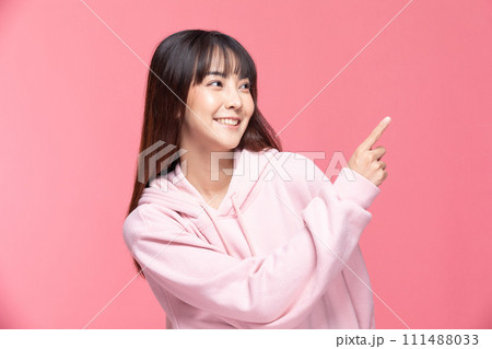 Young Beautiful Asian woman smile with clean and fresh skin Happiness and cheerful with positive emotional pointing up,isolated on pink background,Beauty Cosmetics and spa Treatment Concept Young Beautiful Asian woman smile with clean and fresh skin Happiness and cheerful with positive emotional pointing up,isolated on pink background,Beauty Cosmetics and spa Treatment Concept 111488033