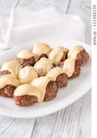 Swedish meatballs with cream sauce 111488130