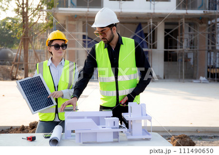 Team young engineer or architect meeting and planning installation solar panel. 111490650