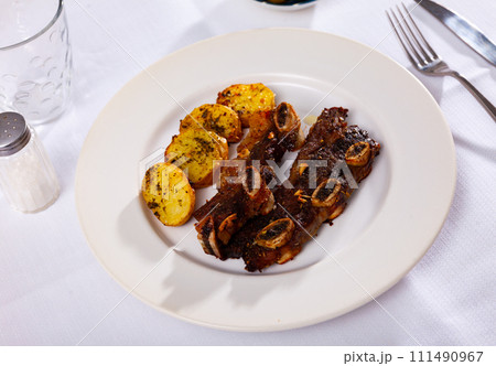 Beef rib steak, churrasco, with fried potatoes Beef rib steak, churrasco, with fried potatoes 111490967