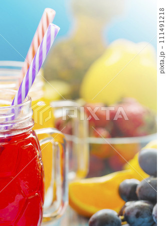 Fresh pineapple and strawberry smoothie in glasses with fruits 111491218