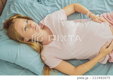 Sleep-deprived pregnant woman struggles with insomnia, navigating the challenges of restlessness during pregnancy 111492075