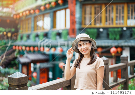 woman traveler visiting in Taiwan, Tourist with hat sightseeing in Jiufen Old Street village with Tea House background. landmark and popular attractions near Taipei city . Travel and Vacation concept woman traveler visiting in Taiwan, Tourist with hat sightseeing in Jiufen Old Street village with Tea House background. landmark and popular attractions near Taipei city . Travel and Vacation concept 111495178