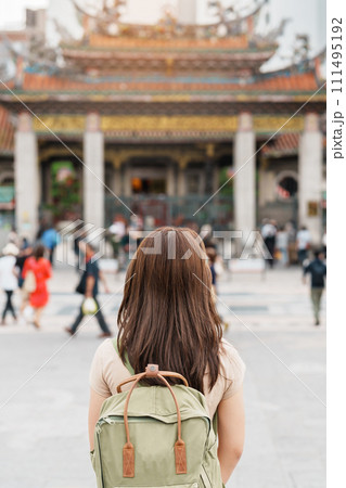 woman traveler visiting in Taiwan, Tourist with hat sightseeing in Longshan Temple, Chinese folk religious temple in Wanhua District, Taipei City. landmark and popular. Travel and Vacation concept woman traveler visiting in Taiwan, Tourist with hat sightseeing in Longshan Temple, Chinese folk religious temple in Wanhua District, Taipei City. landmark and popular. Travel and Vacation concept 111495192