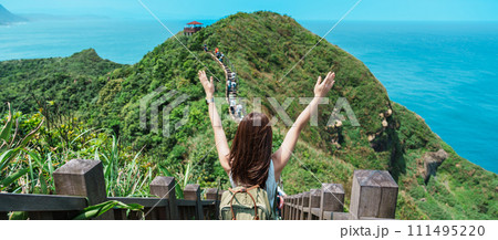 woman traveler visiting in Taiwan, Tourist with backpack sightseeing in Bitou Cape Hiking Trail, New Taipei City. landmark and popular attractions near Taipei. Asia Travel concept woman traveler visiting in Taiwan, Tourist with backpack sightseeing in Bitou Cape Hiking Trail, New Taipei City. landmark and popular attractions near Taipei. Asia Travel concept 111495220