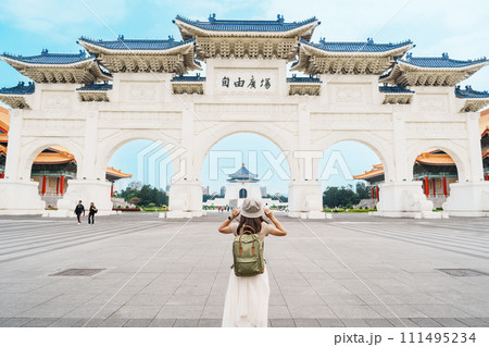 woman traveler visiting in Taiwan, Tourist with backpack sightseeing in National Chiang Kai shek Memorial or Hall Freedom Square, Taipei City. landmark and popular attractions. Asia Travel concept woman traveler visiting in Taiwan, Tourist with backpack sightseeing in National Chiang Kai shek Memorial or Hall Freedom Square, Taipei City. landmark and popular attractions. Asia Travel concept 111495234