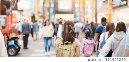 woman traveler visiting in Taiwan, Tourist with bag sightseeing and Shopping in Ximending street Market, landmark and popular attractions in Taipei city. Asia Travel and Vacation concept 111495240