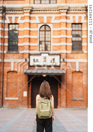 woman traveler visiting in Taiwan, Tourist sightseeing at Red House or old theater in Ximen, Taipei City. landmark and popular attractions. Asia Travel, Trip and Vacation concept 111495243