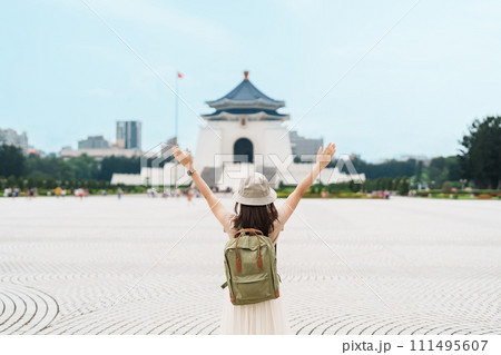 woman traveler visiting in Taiwan, Tourist with backpack sightseeing in National Chiang Kai shek Memorial or Hall Freedom Square, Taipei City. landmark and popular attractions. Asia Travel concept woman traveler visiting in Taiwan, Tourist with backpack sightseeing in National Chiang Kai shek Memorial or Hall Freedom Square, Taipei City. landmark and popular attractions. Asia Travel concept 111495607