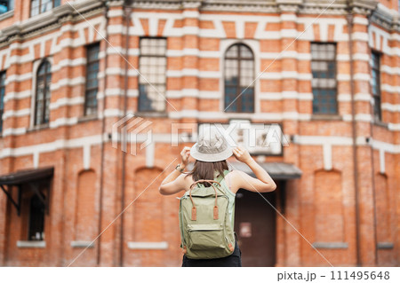 woman traveler visiting in Taiwan, Tourist sightseeing at Red House or old theater in Ximen, Taipei City. landmark and popular attractions. Asia Travel, Trip and Vacation concept 111495648