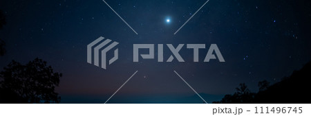 travel and people activity concept with star in the night with tree on mountain and lighting of city background 111496745