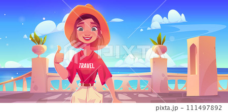 Young woman in hat on sea or ocean shore terrace 111497892