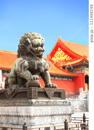 Ancient pavilions and lion statue in Forbidden City. Bronze chinese guardian lion in front of Gate of Supreme Harmony, Forbidden City, Beijing, China Ancient pavilions and lion statue in Forbidden City. Bronze chinese guardian lion in front of Gate of Supreme Harmony, Forbidden City, Beijing, China 111498298